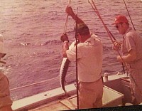 D. E. Warfield (right) enjoys hosting Marathon, Florida/Florida Keys deep sea fishing trip. Brown & Root, Inc. yacht Silver Queen.