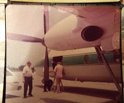 Donald Edwin Warfield at door of yet another Brown & Root, Inc. corporate jet.